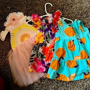 Three 0-6 months old baby girl dresses